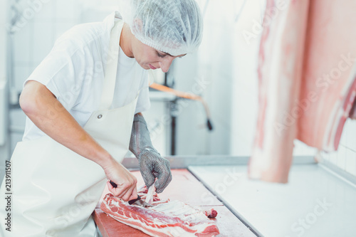Fotografie Pork Meat cutting in butchery
