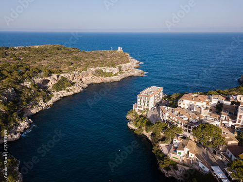 Fototapeta Naklejka Na Ścianę i Meble -  Aerial: Houses on the shore in Cala Figuera, Mallorca, Spain