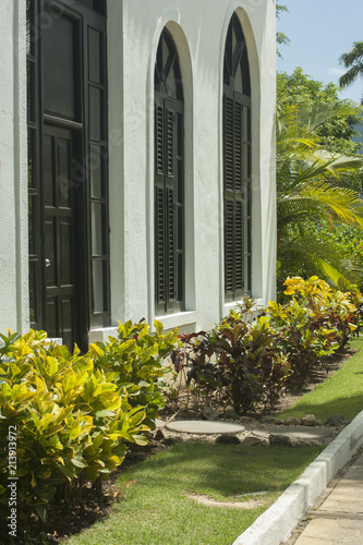 Main entrance of residential house with concrete pavement and doorsteps