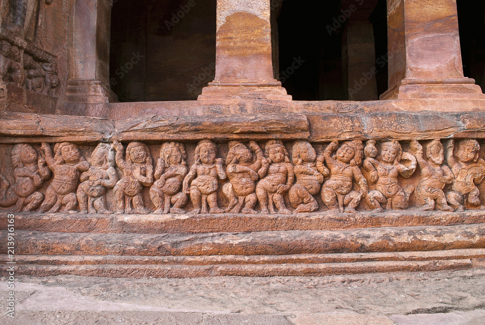 Cave 2 : Facade, Badami Caves, Karnataka, India. Depicting carvings of dwarfish ganas, with bovine and equine heads, in different postures and a Dwarpala.