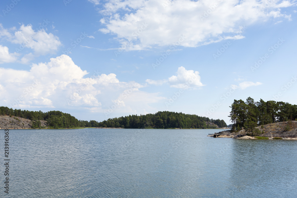 Finnish archipelago on a summer day. Sunny and hot weather at the shores of the Baltic Sea.