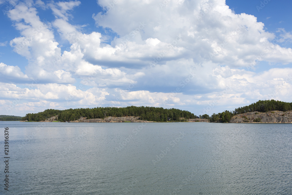 Finnish archipelago on a summer day. Sunny and hot weather at the shores of the Baltic Sea.