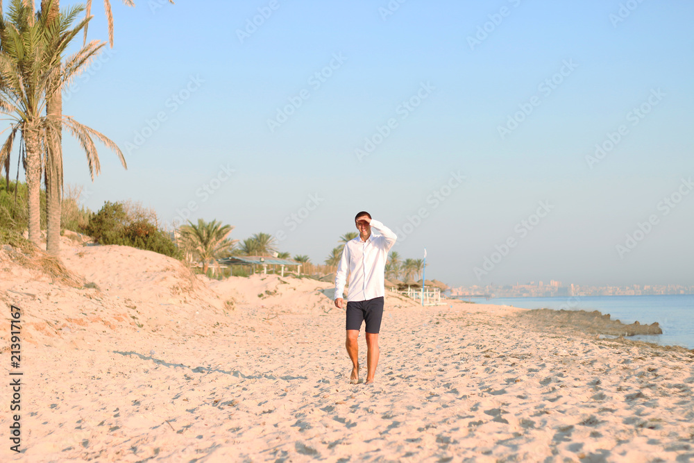 man walk on beach