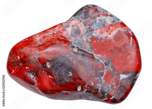 macro shooting of natural mineral stone small pebble red jasper gemstone from Russia isolated on white background photo