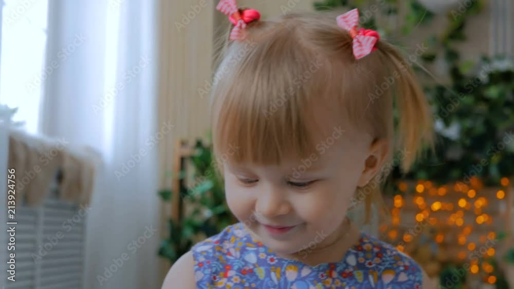 Portrait of funny little girl at home. Family, childhood and leisure concept. Close up shot Portrait of funny little girl at home. Family, childhood and leisure concept. Close up shot