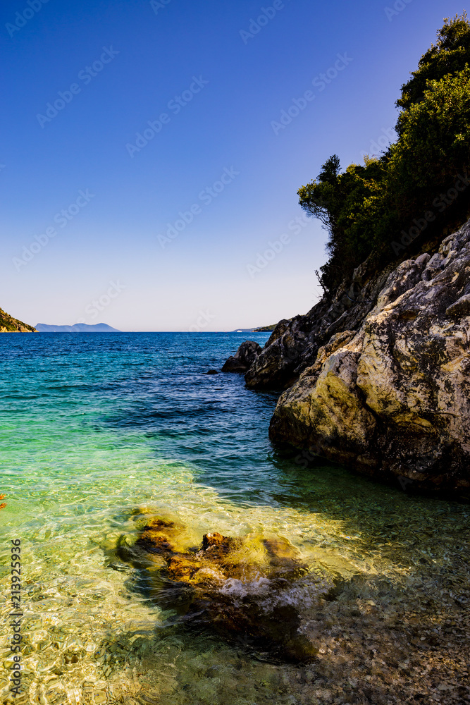 One of most beautful beches Mikros Gialos on Lefkada island, Greece, Ionian Sea One of most beautful beches Mikros Gialos on Lefkada island, Greece, Ionian Sea