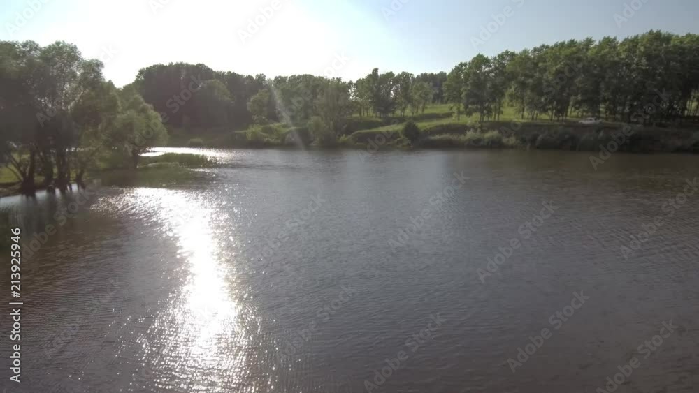 Air view of the river and forest reflection of the sun in the water. Air view of the river and forest reflection of the sun in the water.