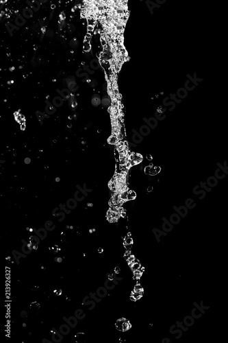 water jet with spray on a black background