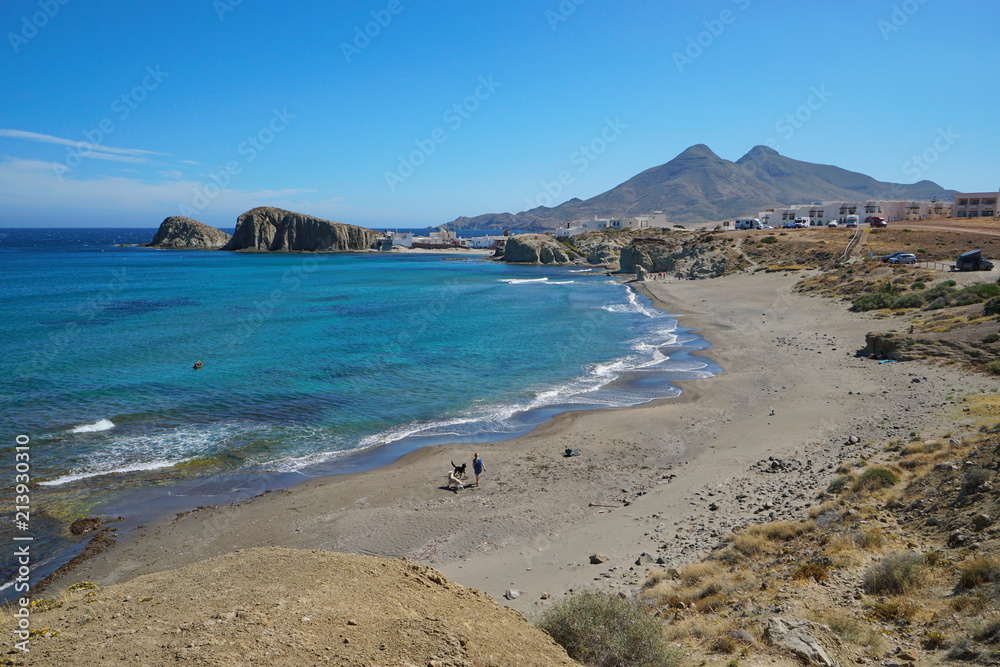 Sandy beach and the village La Isleta del Moro in the Cabo de Gata-Níjar natural park, Mediterranean sea, Almeria, Andalusia, Spain