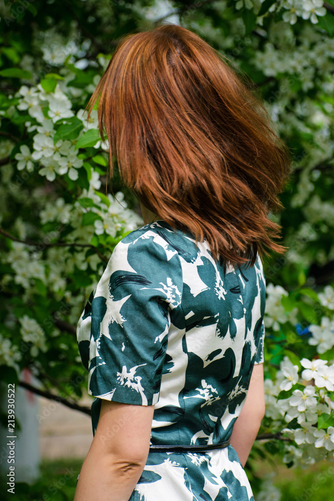 Portrait of a girl with gorgeous hair fluttering in a blowing wind outdoors. Hair fluttering in the wind. Portrait of a girl with gorgeous hair fluttering in a blowing wind outdoors. Hair fluttering in the wind.