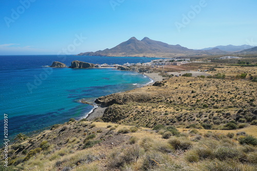 Coastal landscape the village La Isleta del Moro with the massif of Los Frailes in background in the Cabo de Gata-Níjar natural park, Mediterranean sea, Almeria, Andalusia, Spain