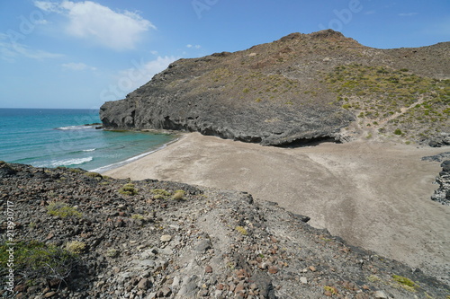 Wild sandy beach and rocky coast, Cala Principe in the Cabo de Gata-Níjar natural park, Mediterranean sea, Almeria, Andalusia, Spain
