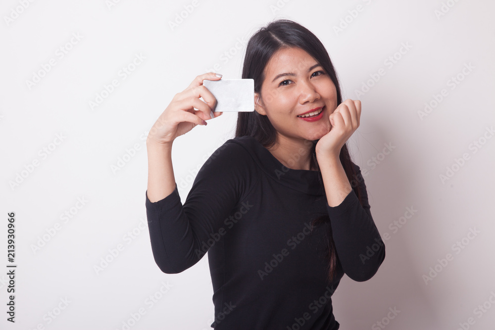 Happy young Asian woman with a blank card. Happy young Asian woman with a blank card.