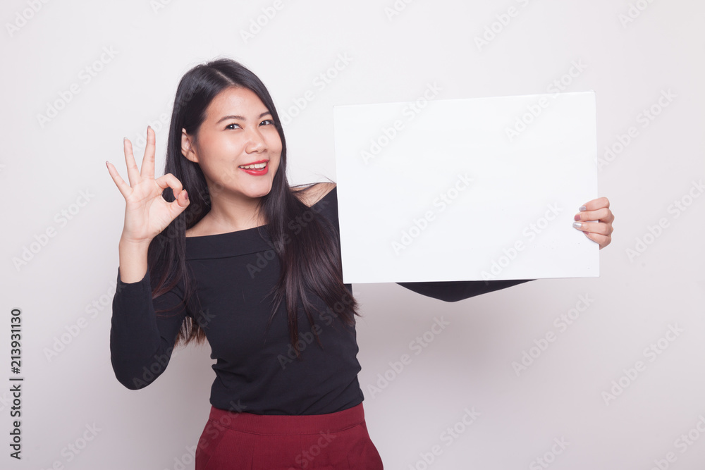 Young Asian woman show OK with white blank sign. Young Asian woman show OK with white blank sign.