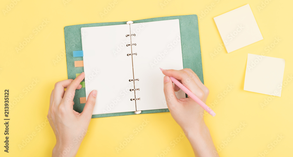 girl's hand writing in notebook girl's hand writing in notebook