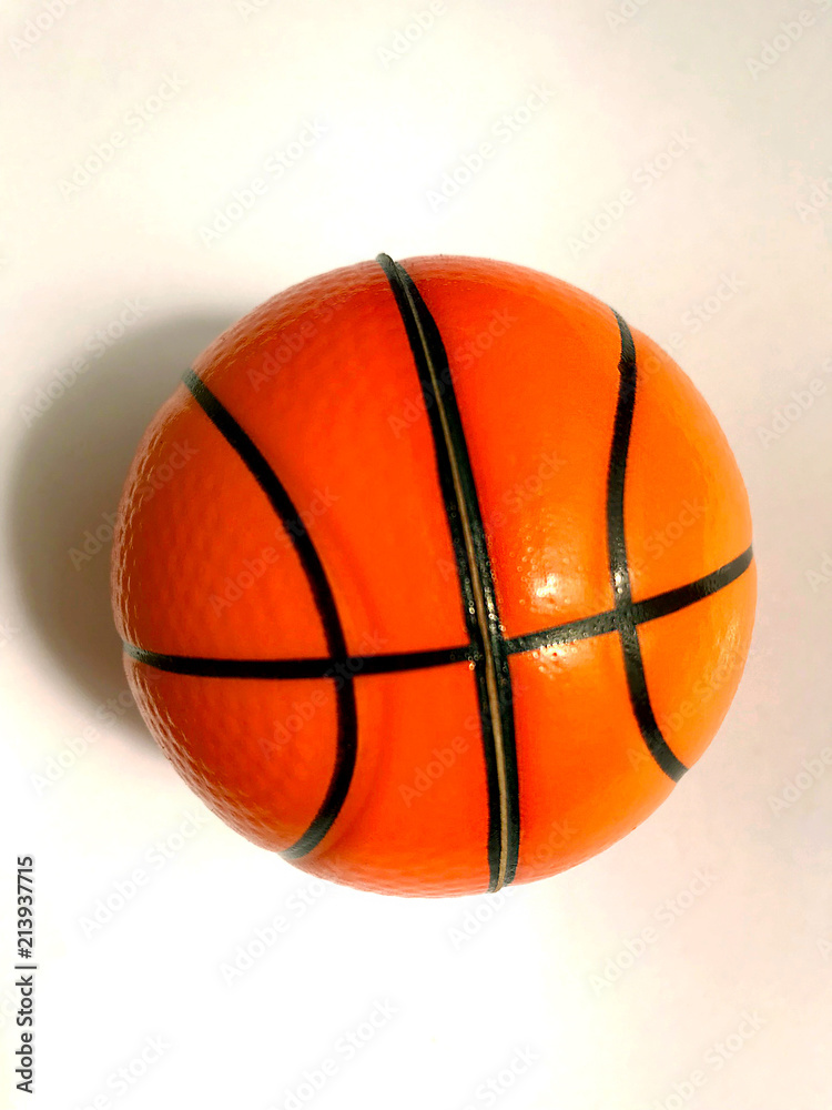 Fototapeta premium Isolated object - an orange ball on a light background.
