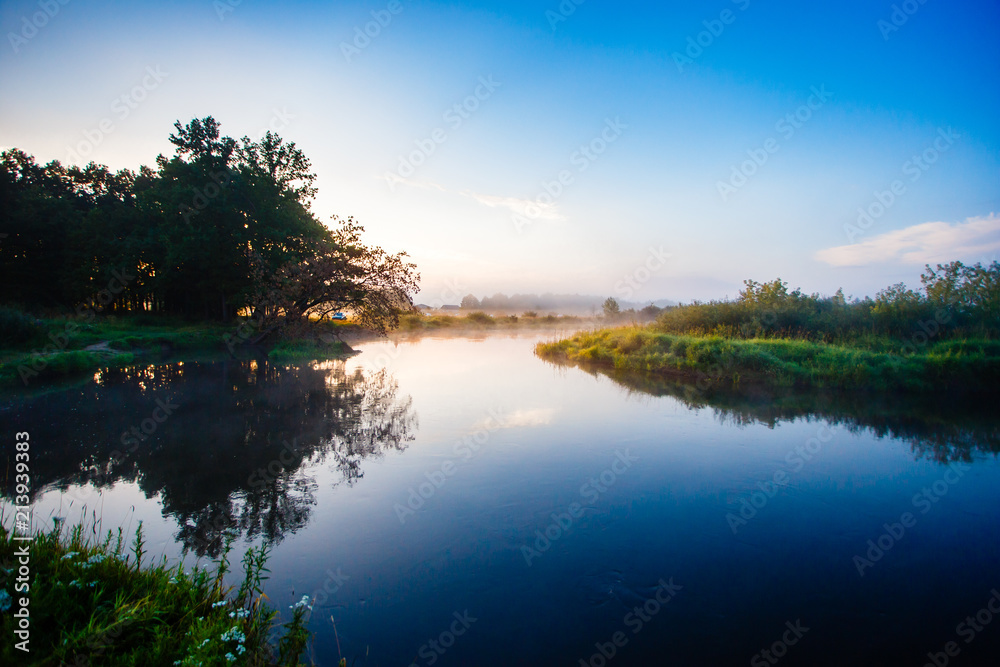 Quiet sunrise over river curve in Belarus. Silence at daybreak in summer