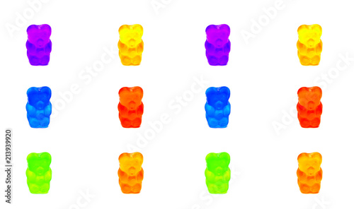 Multicolored gelatinous bears-sweets placed symmetrically at the frame, isolated on white background: Violet, yellow, blue, green, orange and red. Template for the designer.
