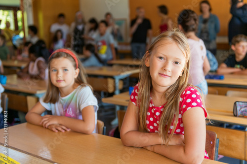 Indoor portrait of a cute little girls in a classroom