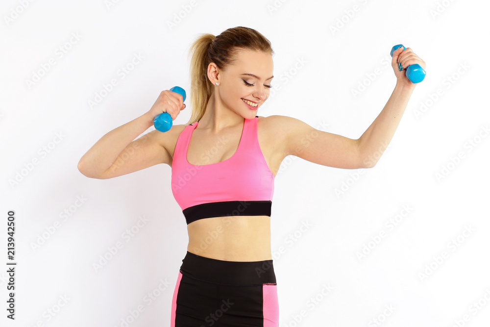 Young girl athlete, fitness with dumbbells isolated on white background Young girl athlete, fitness with dumbbells isolated on white background