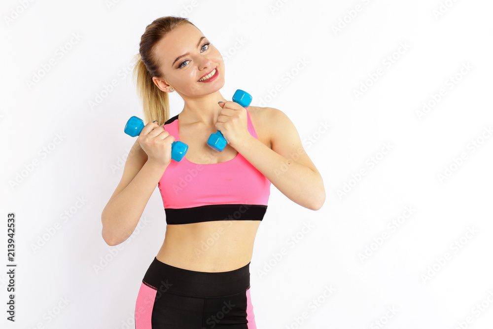 Young girl athlete, fitness with dumbbells isolated on white background Young girl athlete, fitness with dumbbells isolated on white background