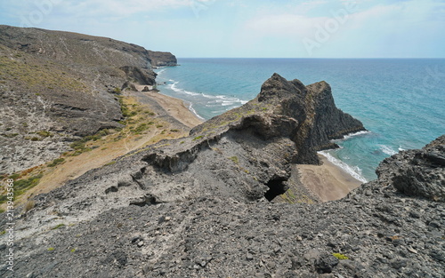 Rocky coastline and sandy beach in the Cabo de Gata-Níjar natural park, Mediterranean sea, Cala Grande, Almeria, Andalusia, Spain