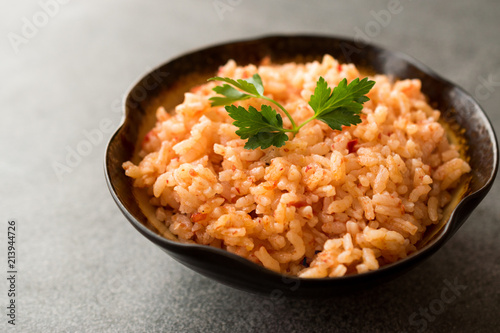 Homemade Tomato Rice with Parsley in Ceramic Bowl / Pilav / Pilaf.