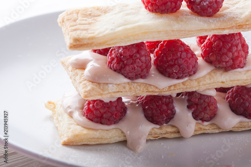 Raspberry mille-feuille dessert on white background