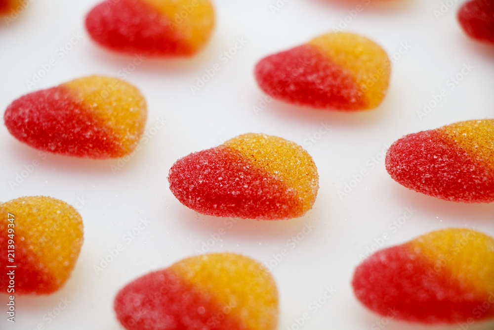 Sweet marmalade in sugar - hearts on a white background. Sweet marmalade in sugar - hearts on a white background.