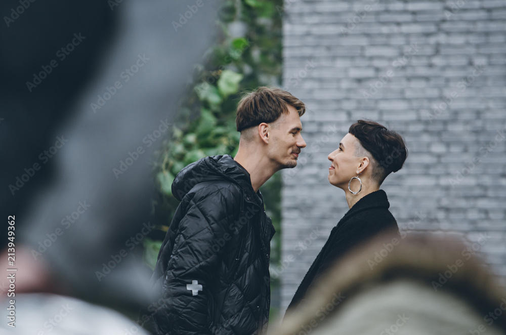 Side view of a attractive young couple, face to face, almost kissing. Side view of a attractive young couple, face to face, almost kissing.