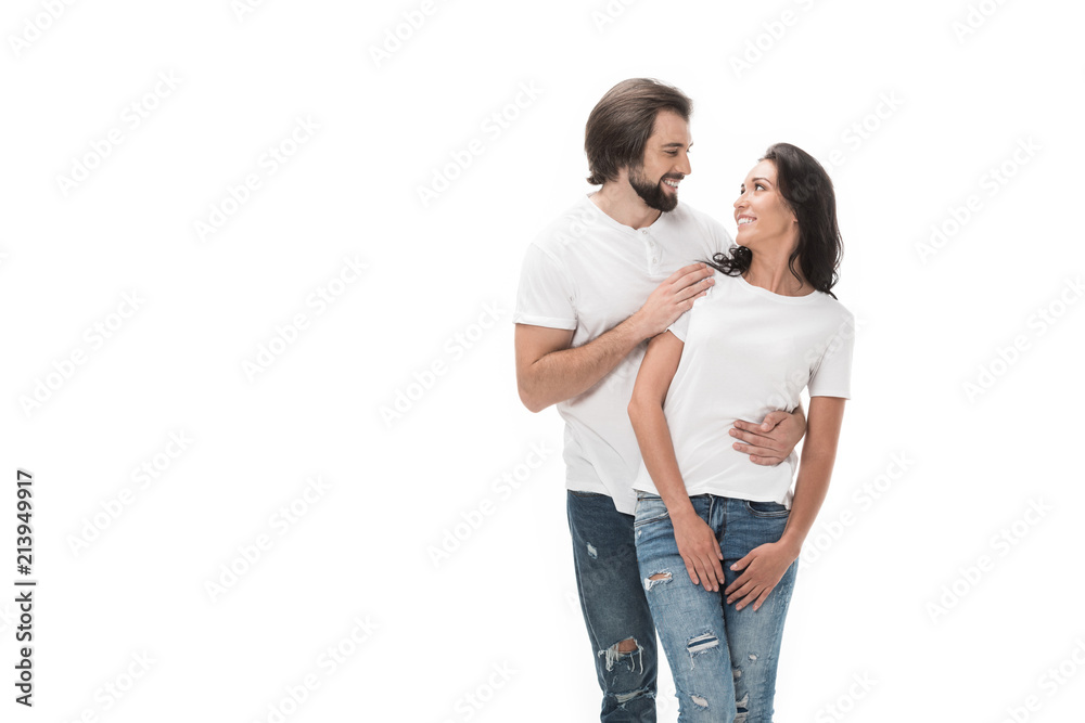 portrait of smiling couple looking at each other isolated on white portrait of smiling couple looking at each other isolated on white