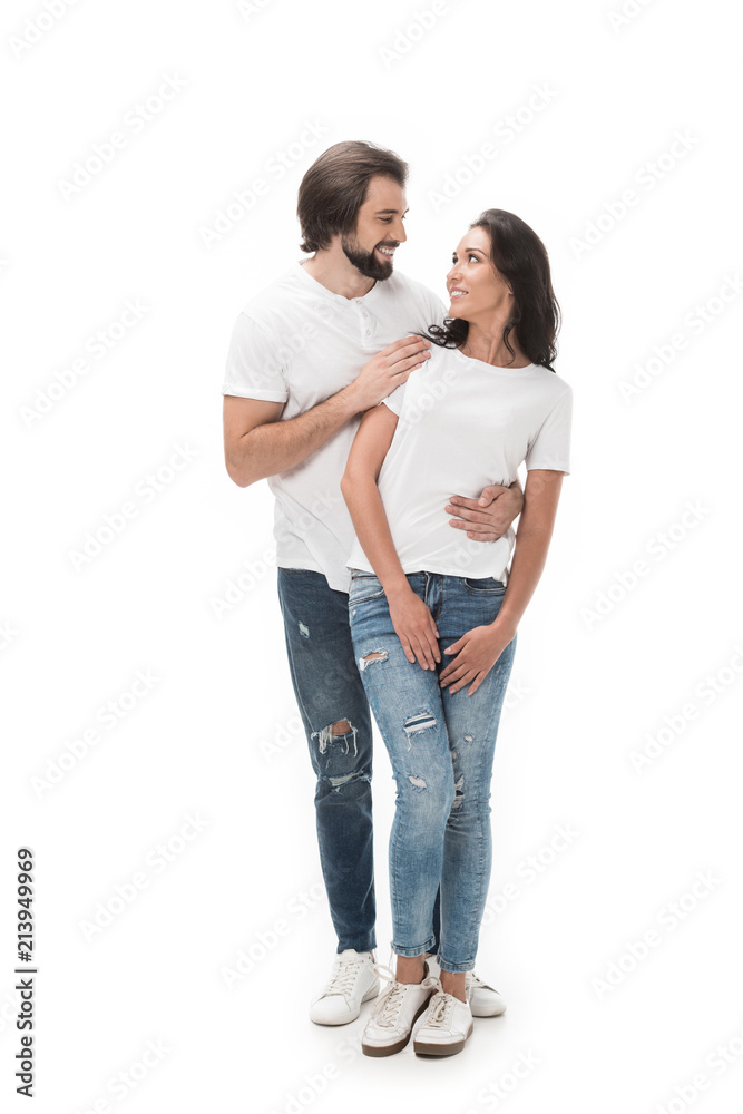 smiling couple looking at each other isolated on white smiling couple looking at each other isolated on white