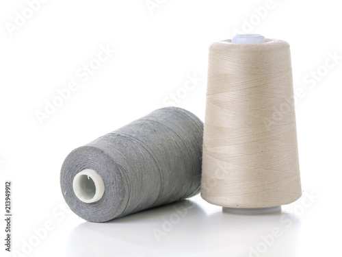 Two cotton thread spools