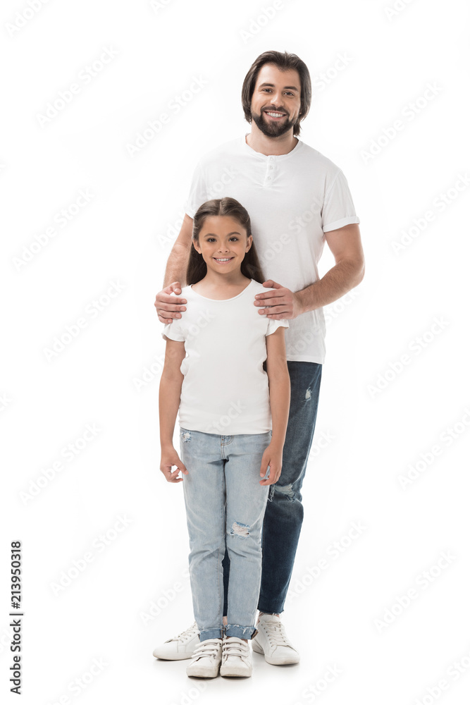 smiling father hugging little daughter isolated on white smiling father hugging little daughter isolated on white