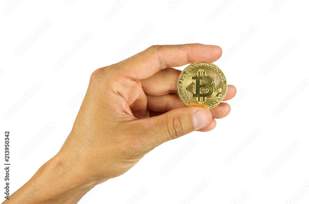 human hand holds coin of bitcoin between fingers, isolated human hand holds coin of bitcoin between fingers, isolated