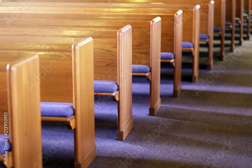 Rows of Church Pews in an Empty Church Sanctuary photo