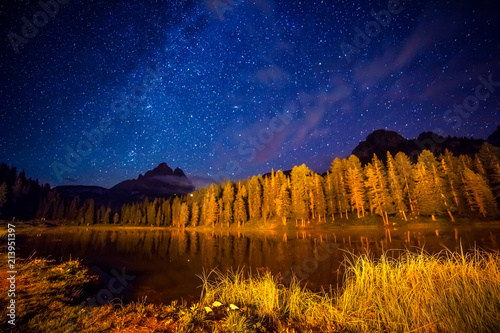 Cadini di Misurina range and Antorno lake under starry light in Natural park Tre Cime di Lavaredo.