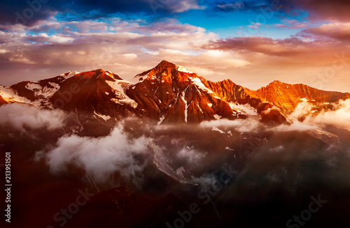 A look at the sunlit hills at twilight. Dramatic evening scene.