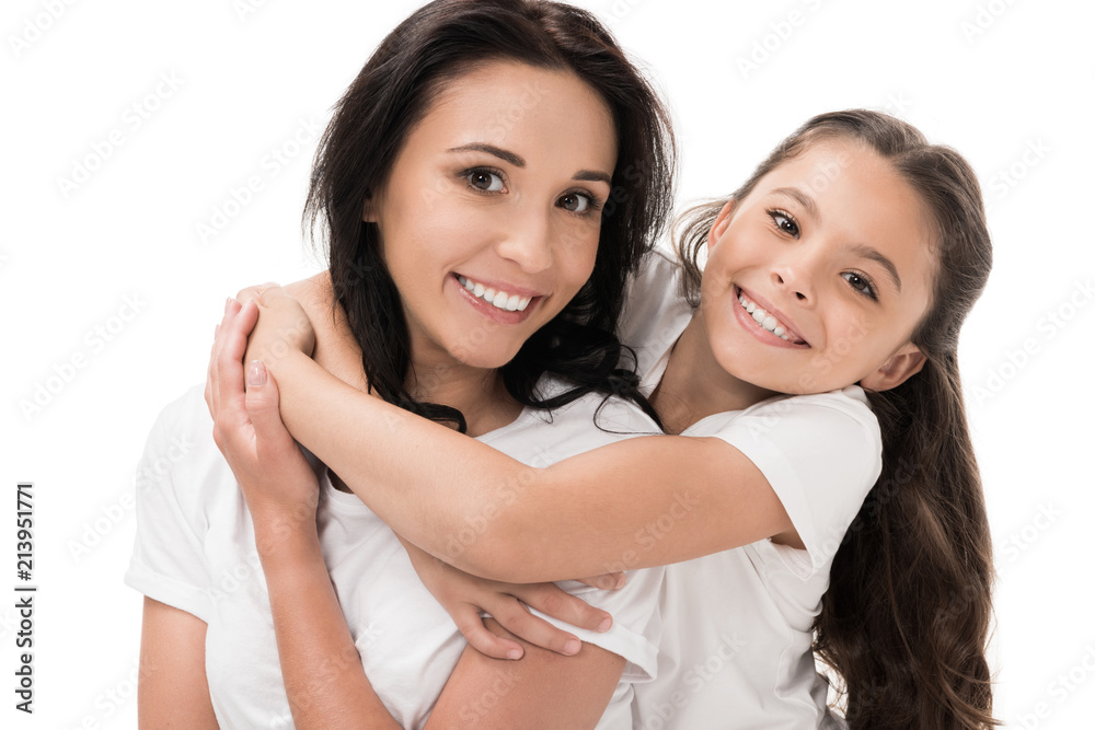 portrait of happy mother and daughter in white shirts isolated on white portrait of happy mother and daughter in white shirts isolated on white