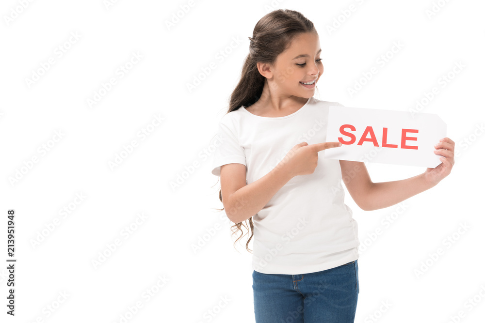 portrait of smiling kid pointing at sale banner in hand isolated on white portrait of smiling kid pointing at sale banner in hand isolated on white