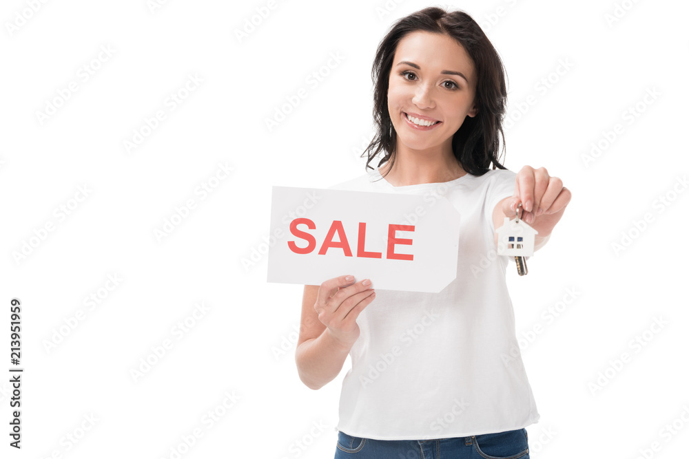 portrait of smiling woman with sale card showing keys isolated on white portrait of smiling woman with sale card showing keys isolated on white