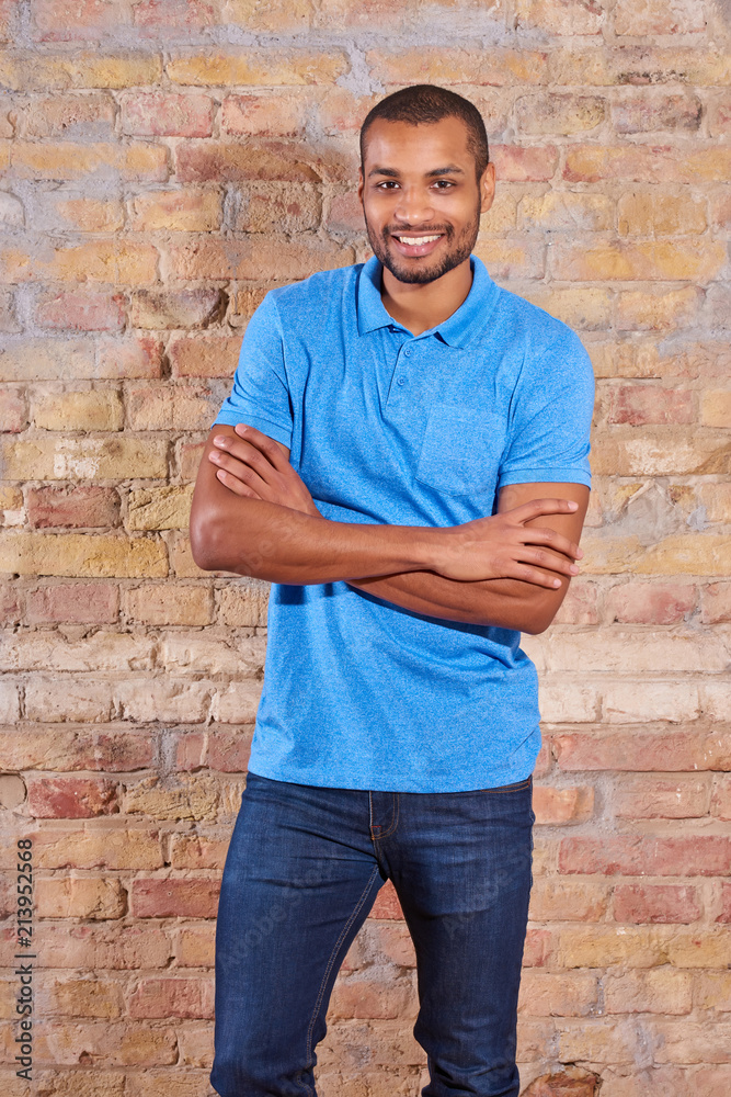Portrait of a happy handsome young man in a blue tshirt. Portrait of a happy handsome young man in a blue tshirt.