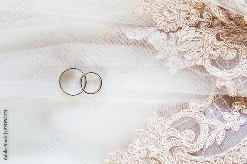 Wedding rings on lace veil