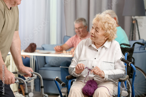 Senior woman in wheelchair ...