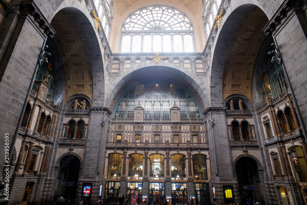 the clock is on the top level Of the Central train station in Antwerp, Belgium.