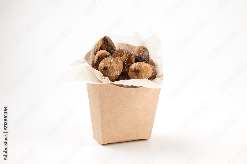 Isolated chestnuts in paper bag on white background Isolated chestnuts in paper bag on white background