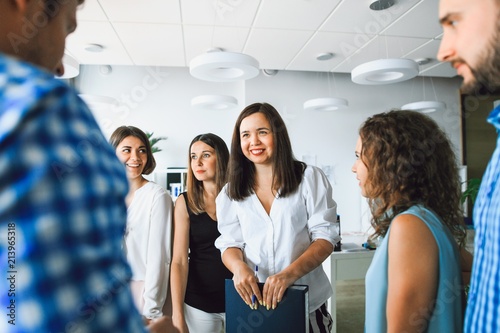 Business lady holds a meeting with colleagues in the office