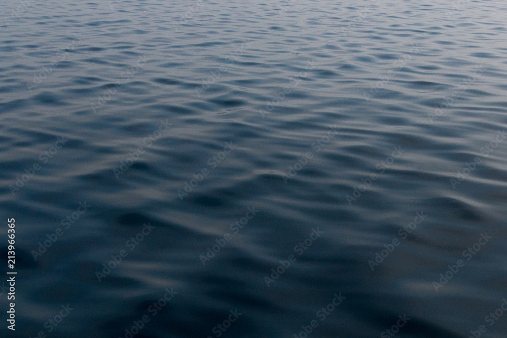 Calm Lake Huron water with ripples in the early morning background