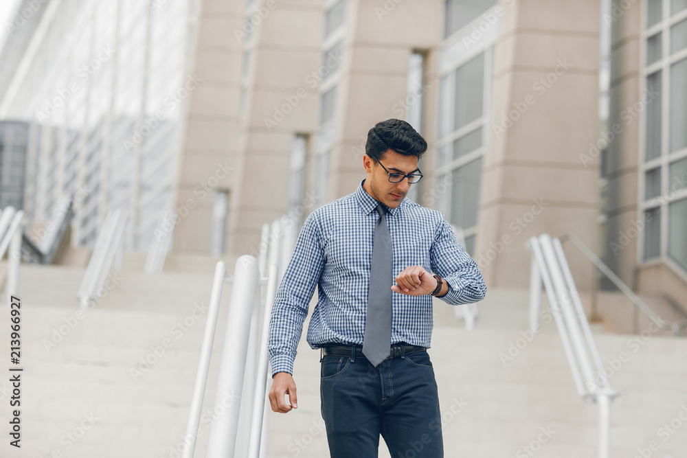 Fototapeta premium businessman in a summer city