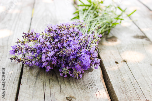 Fototapeta Naklejka Na Ścianę i Meble -  A bouquet of fresh cut lavender with tableware Gzhel
